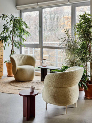 Kori Armchair with Biurgundy Round and Oval Shaped Side Table in Lounge Setting