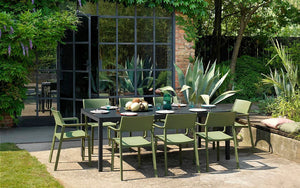 Nardi Thrill Stackable Monobloc Chair with Armrest in Green with Black Table in Outdoor Dining Settings