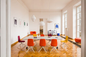 Plex Folding White Board Table on Castors with Office Chairs and Lounge Chair in Meeting Room Setting
