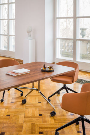 Plica Rectangular Folding Table on Castors with Tub Chairs in Modern Office Setting 2