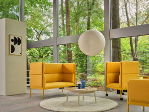 Stilt High Back Monochromatic Armchair with Sofa and Coffee Table in Reception Setting
