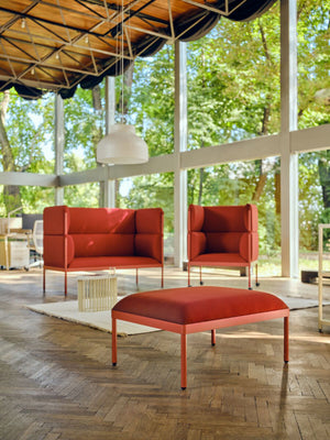 Stilt High Back Monochromatic Armchair with Sofa and Pouffe in Reception Setting