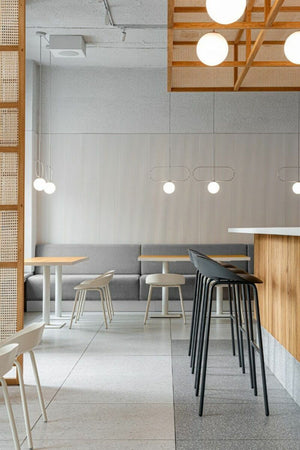 Team Polypropylene Ergonomic Low Stool with Canteen Table and High Stool in Canteen Setting