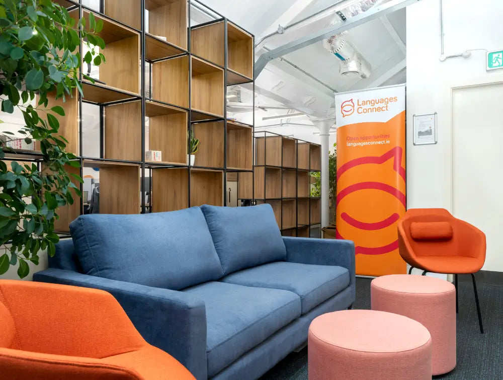 2 Seater Sofa with Tub Chair and Shelves in Canteen Setting