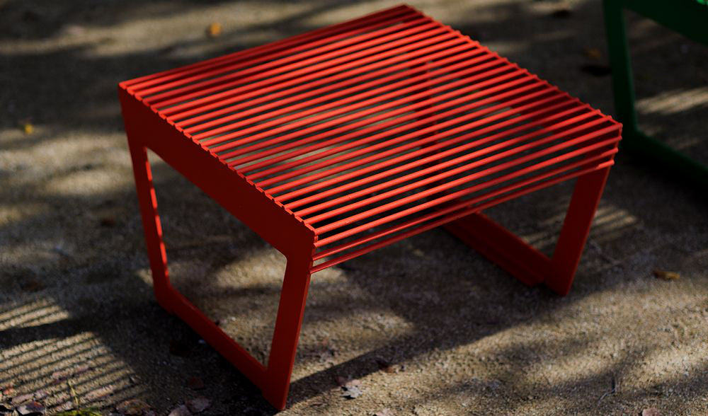Arte Outdoor Low Stool in Outdoor Setting