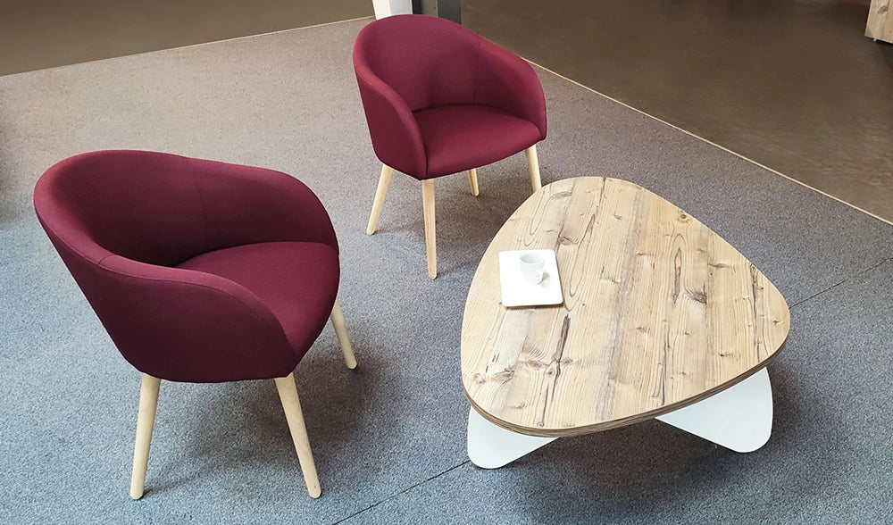 Buronomic Pebble Design Coffee Table In Oak Top Finish With Red Armchair In Living Room Area
