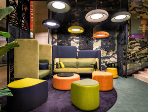 Buzzidee Acoustic Pouf 2 In Different Colors With Sofa And Side Table In Bar Setting