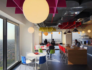 BuzziGrid Sound Absorbing Panel with White Round Tables at Breakout Area