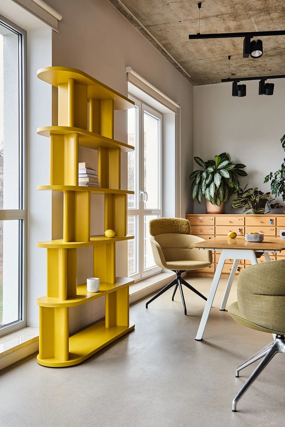 Cactus Nature Inspired Rectangular Bookcase in Yellow Finish with Armchairs and Rectangular Table in Modern Office Setting