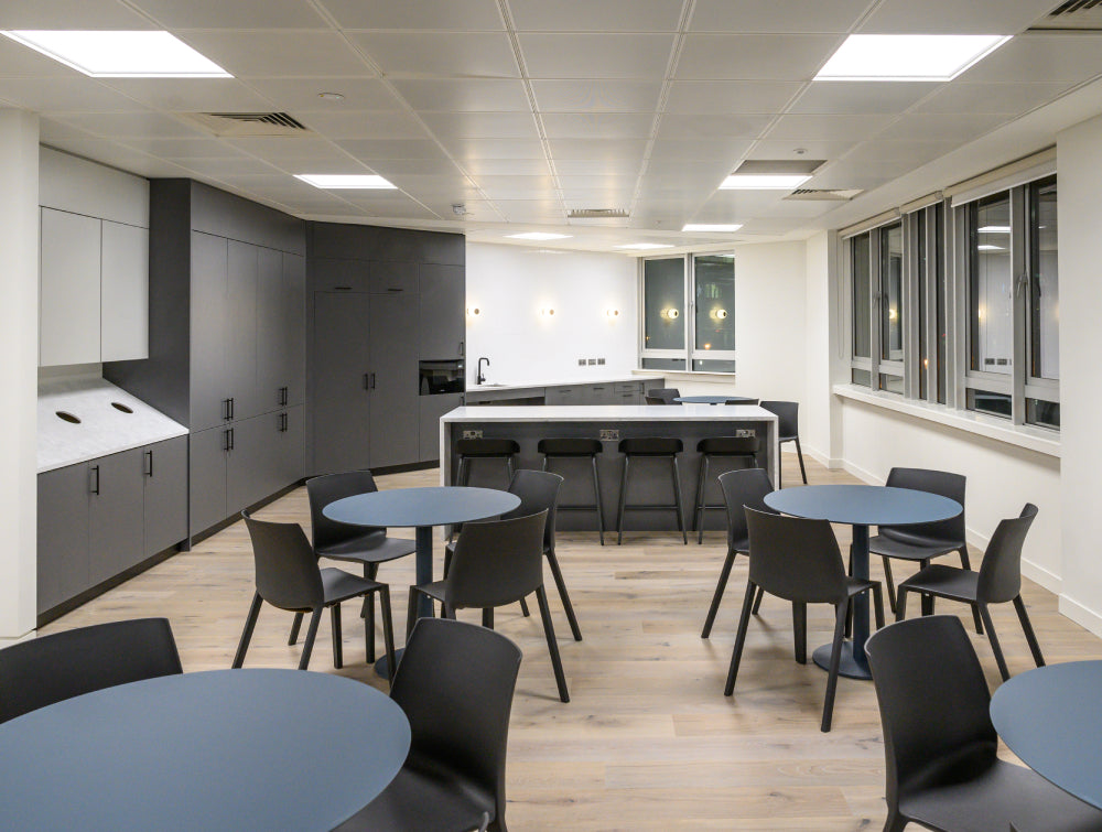 Canteen Chairs With Round Tables And High Stool In Kitchen Setting