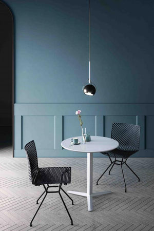 Fuller Chair With Round Table And Flower Vase In Cafe Setting