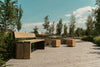 Gavarres Wooden Outdoor Bench with Modular Chairs in Outdoor Setting