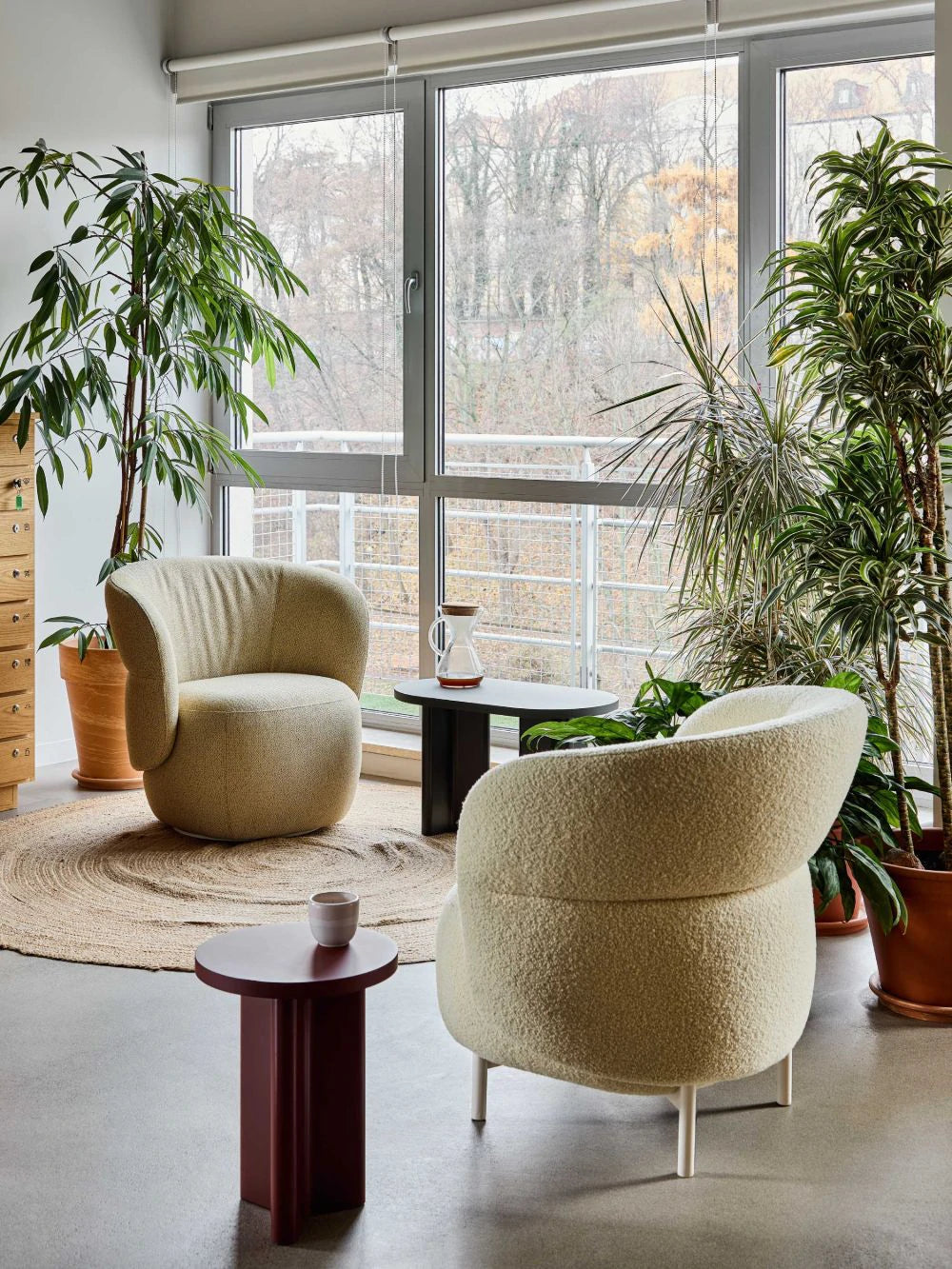 Kori Armchair with Biurgundy Round and Oval Shaped Side Table in Lounge Setting