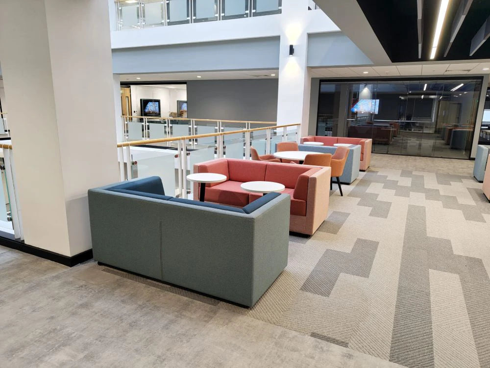 Lenny 2 Seater Low Back Chair in Different Finishes with White Top Tables in Modern Lounge Setting 2