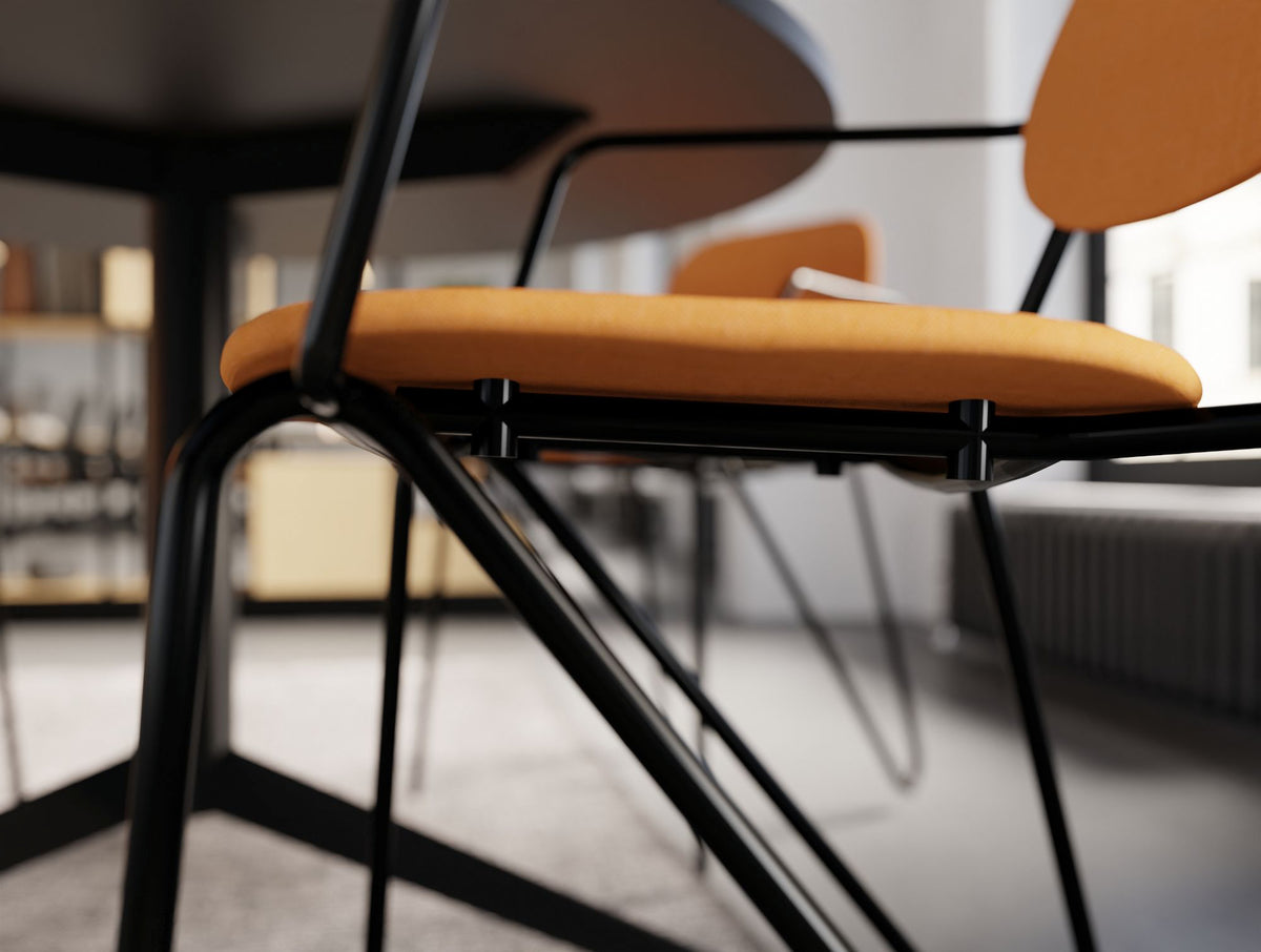 Line Canteen Chair Seat Detail in Upholstered Orange Finish with Black Steel Frame