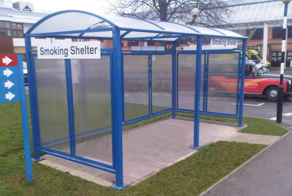 M Barrel Roof Bicycle Shelter with Extension and Back and Side Cladding 3 in Blue Finish with Smoking Shelter Sign