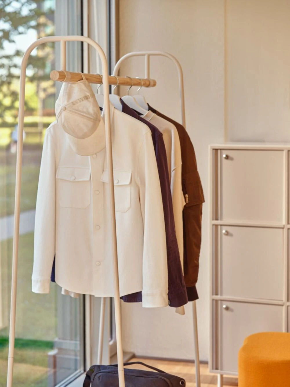 Mono Coat Hanger with Rail in White Finish with Orange Pouffe and Beige Lockers 2