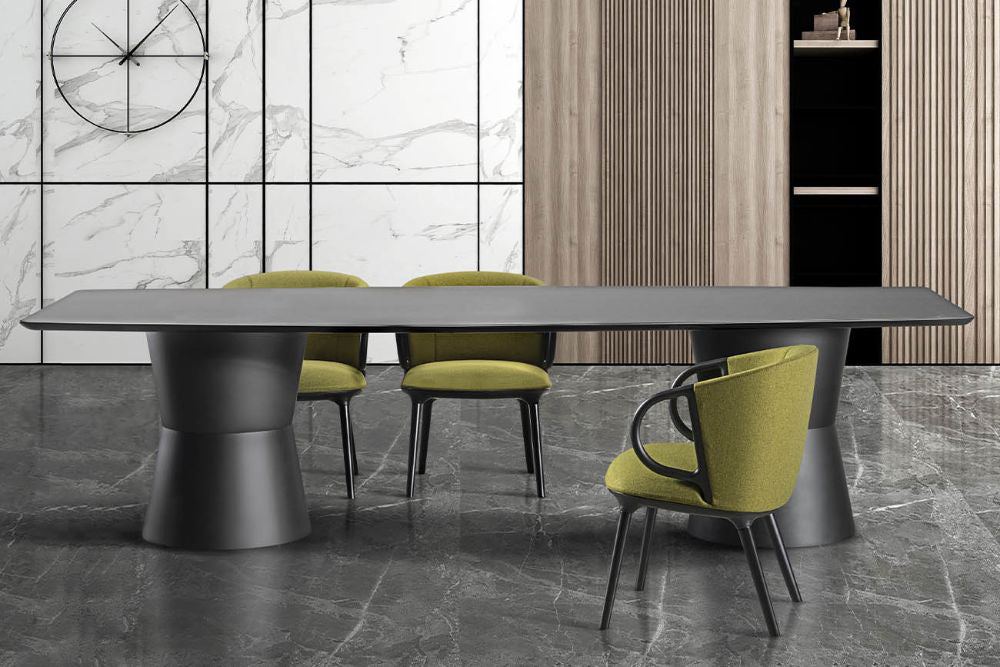 Nidaba Meeting Room Table With Armchair And Wall Clock In Meeting Room Setting