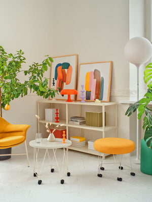 Pental Round Mobile Pouffe With Coffee Table And Lounge Chair In Office Setting
