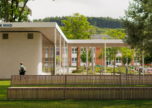 Riga Wooden Outdoor Bench in Outdoor Setting