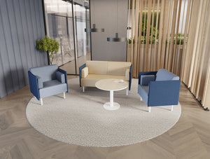 Snug Office Soft Seating Blue and 2 Seater Sofa with Key Round Cylinder Base Table in Modern Office Setting