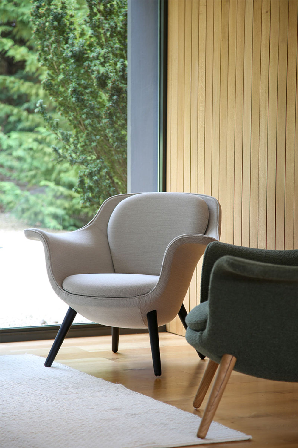 Trost Low Back Lounge Armchair In Grey Finish With Rug In Breakout Setting