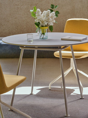 Ulti Office Chair on 4 Star Aluminium Base with Castors with Round Table in Modern Office Setting