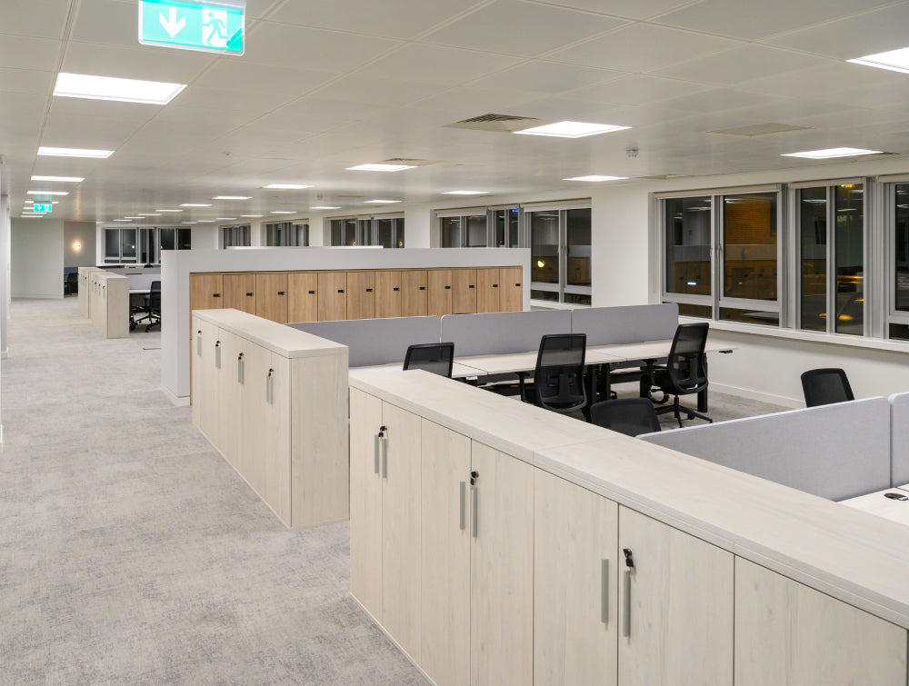 Wooden Cupboard With Task Chair And Sit Stand Desk In Modern Office Setting