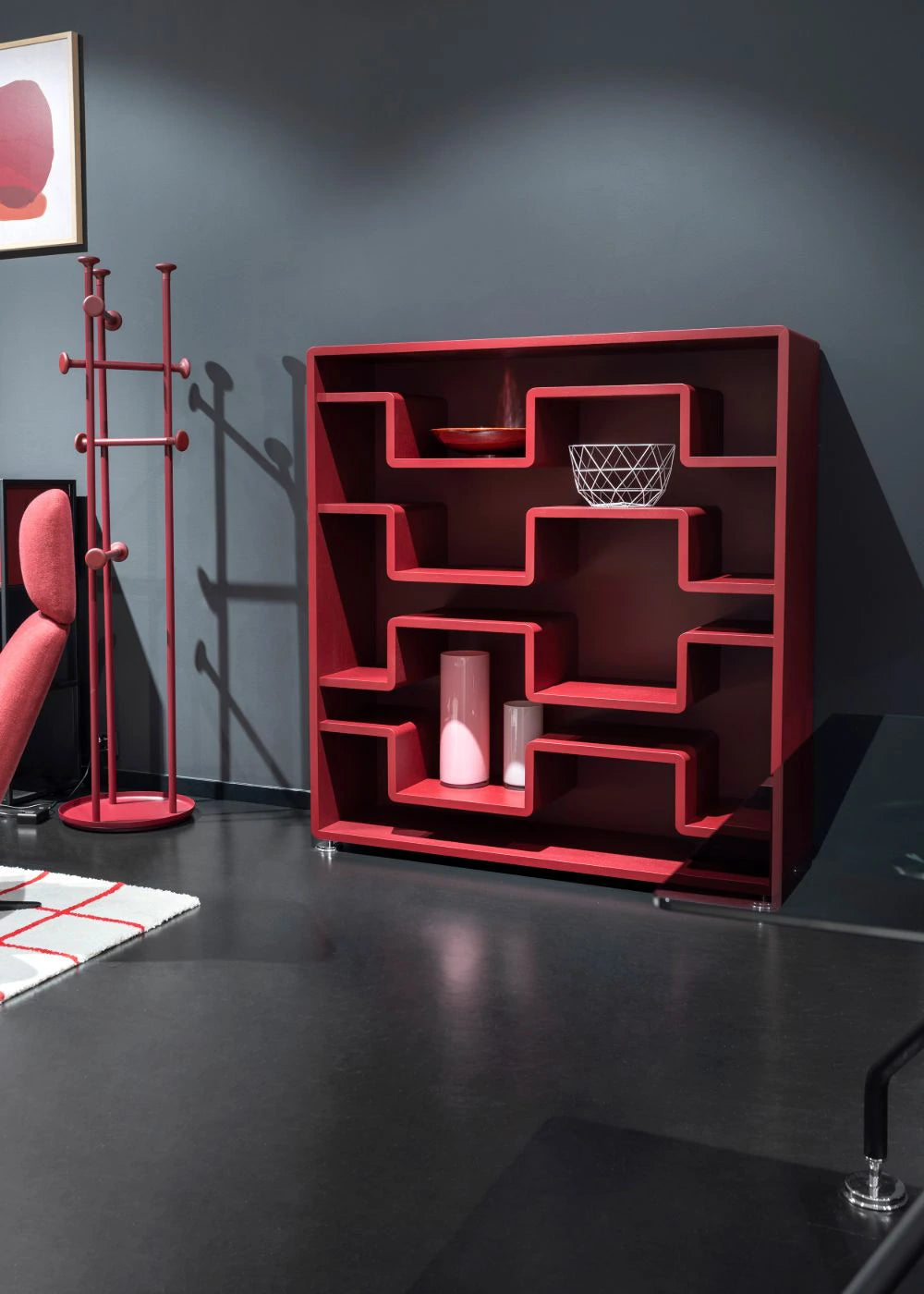 Xeon Wooden Bookcase 8 in Red Finish with Red Steel Coatrack in Modern Office Setting